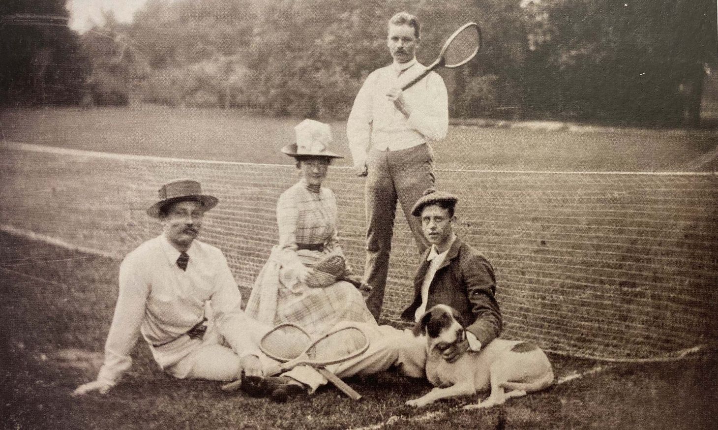Photo of Anna at a tennis court with her husband, Richard Zanders, and friends in 1887.