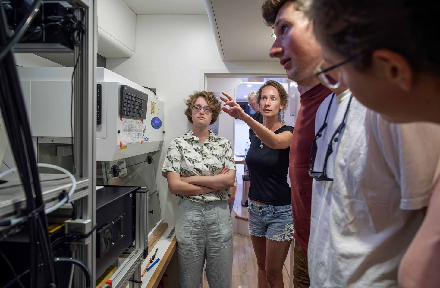 Oceanographer Hedy Aardema (centre) shows the three interns around the atmosphere lab, where samples—aerosols and other particles—from the lower atmosphere are analysed.