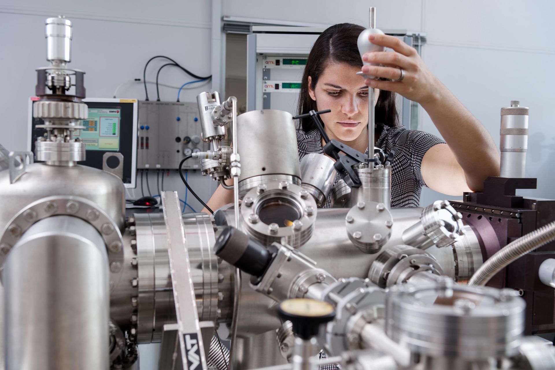 Materials engineer Dr Gabriela Borin Barin from the CarboQuant team examining a sample of carbon nanoribbons in the scanning tunnelling microscope. Materials engineer Dr Gabriela Borin Barin during an examination with the scanning tunnelling microscope