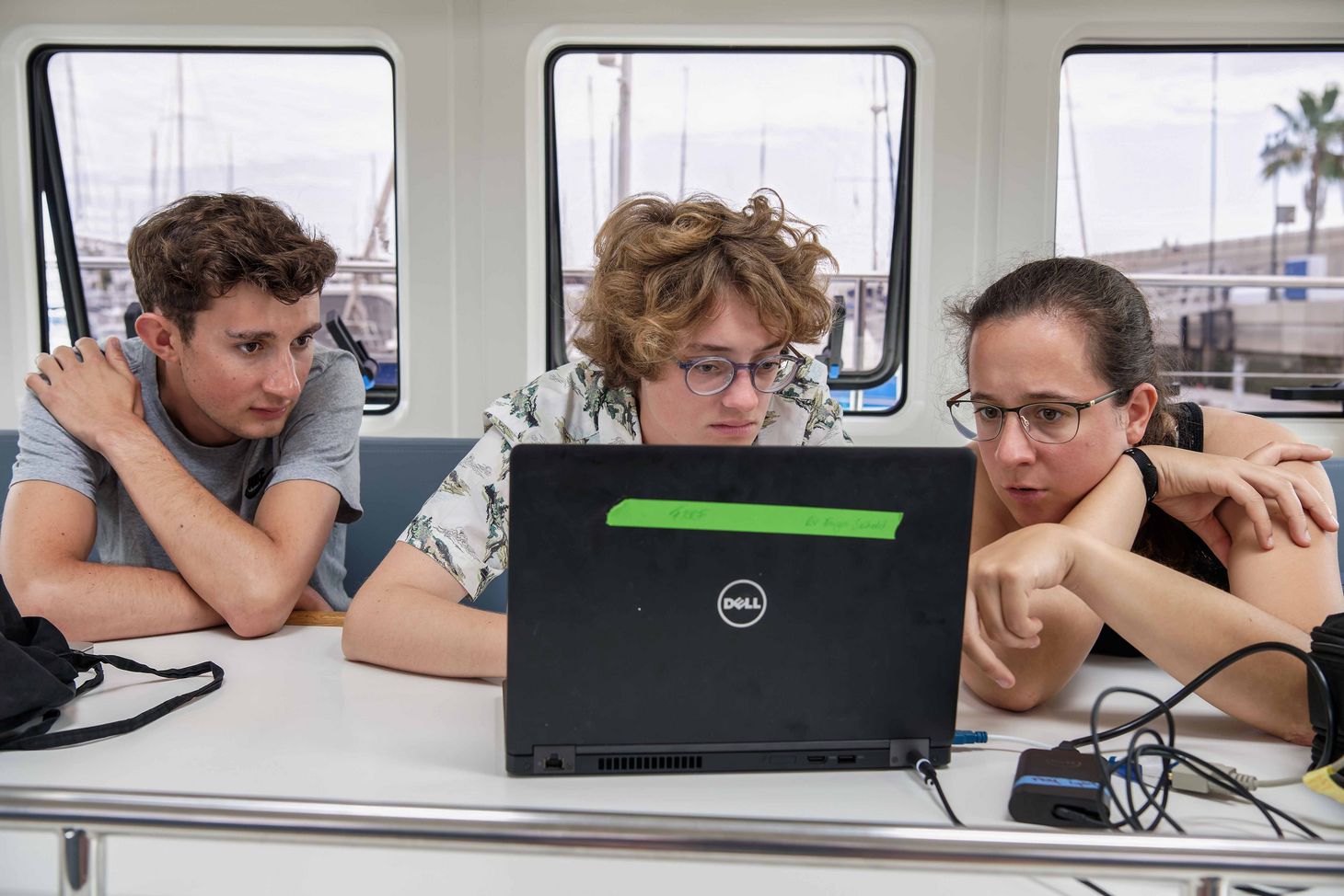 The three students while analyzing the plankton samples.